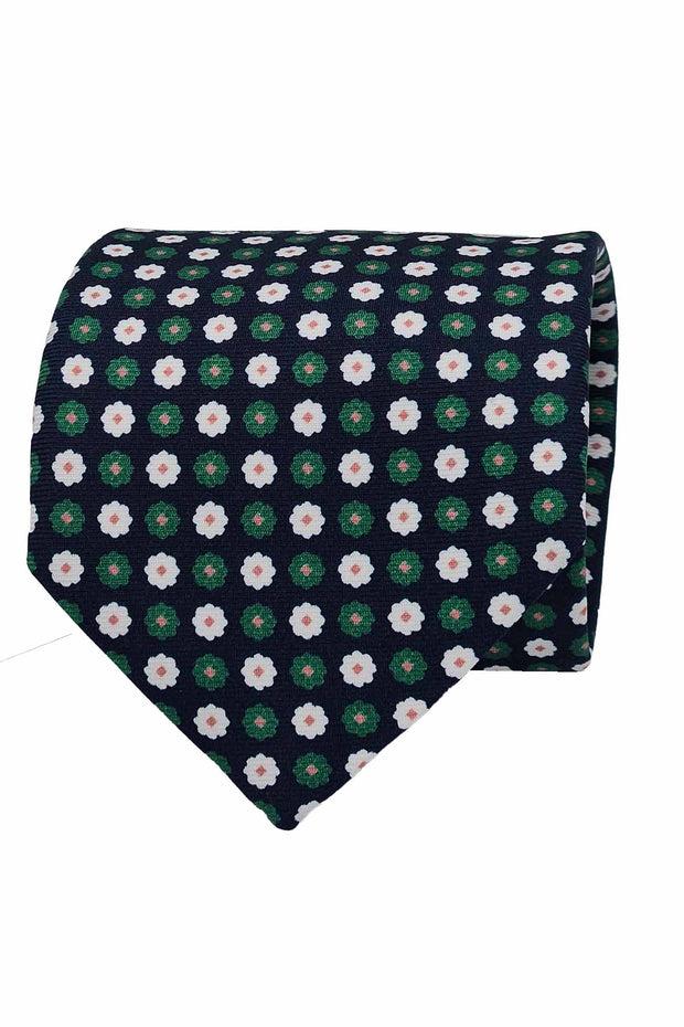 Cravatta in seta stampata blu con pattern floreale verde e bianco