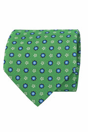 Cravatta stampata verde con pattern micro floreale bianco e azzurro