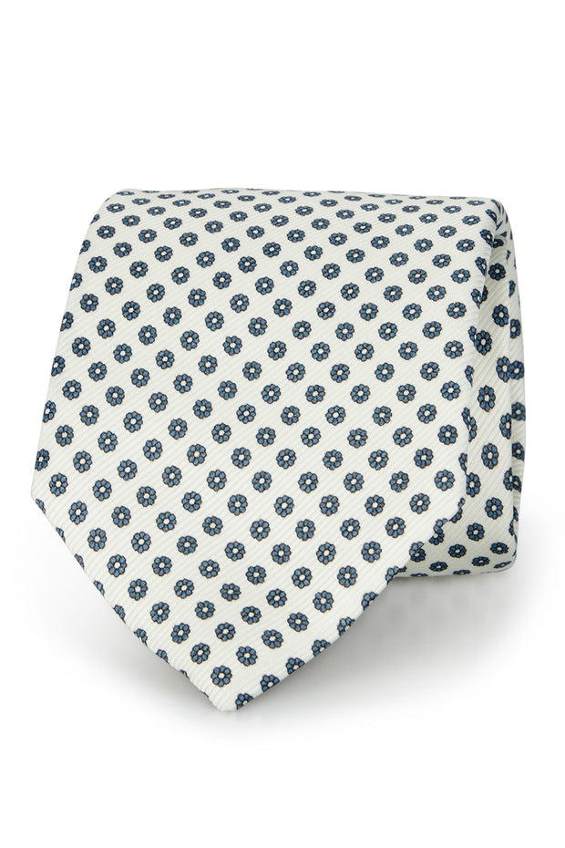 Cravatta in seta stampata bianca con micro fiori azzurri 