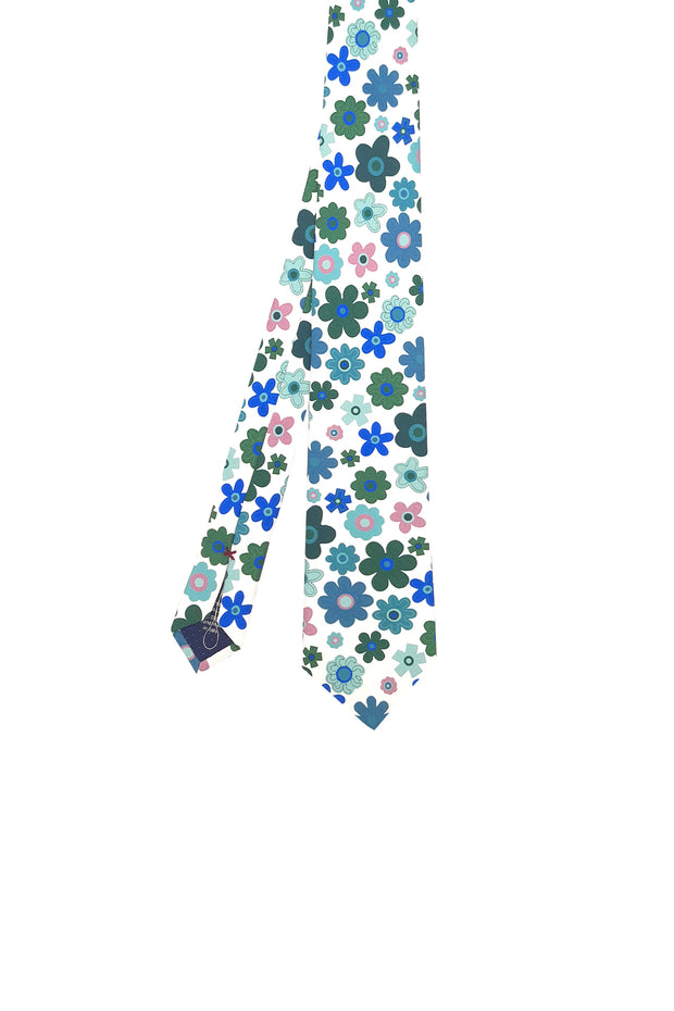 Limited series silk tie with green stylized flowers print on a white background