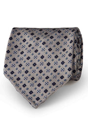 Cravatta sfoderata in pura seta color grigio, blu scuro, azzurro & bianco con motivi di diamanti & fiori  - Fumagalli 1891