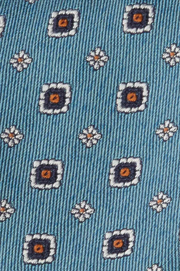 Cravatta in seta azzurra con piccoli medaglioni e fiori - Fumagalli 1891   