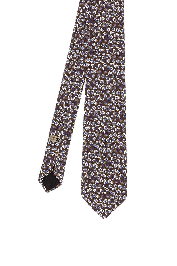 Cravatta stampata in seta su fondo marrone con piccoli fiori bianco, blu e beige - Fumagalli 1891