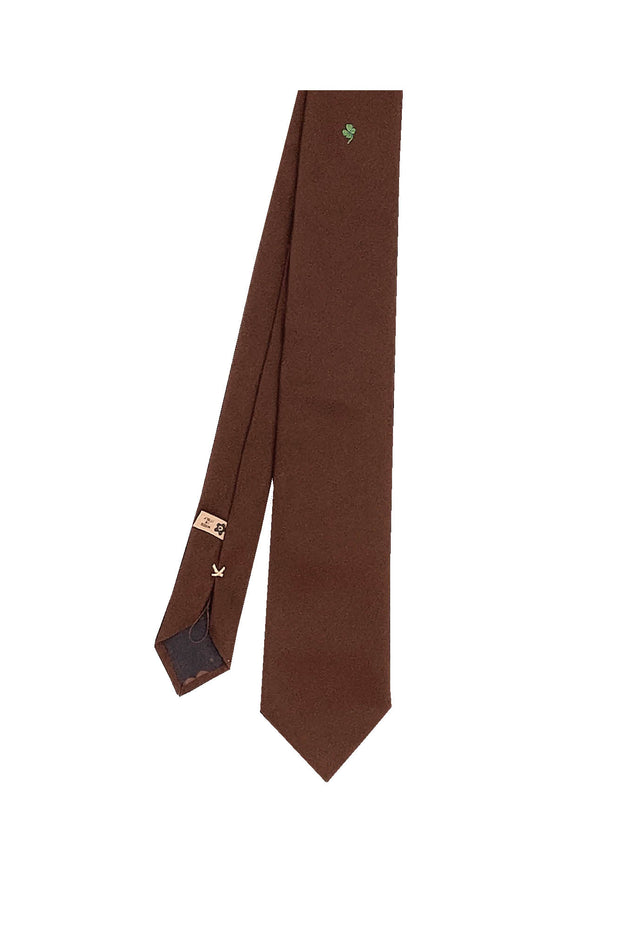 Brown silk tie with four-leaf clover under the knot