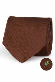 Brown silk tie with four-leaf clover under the knot