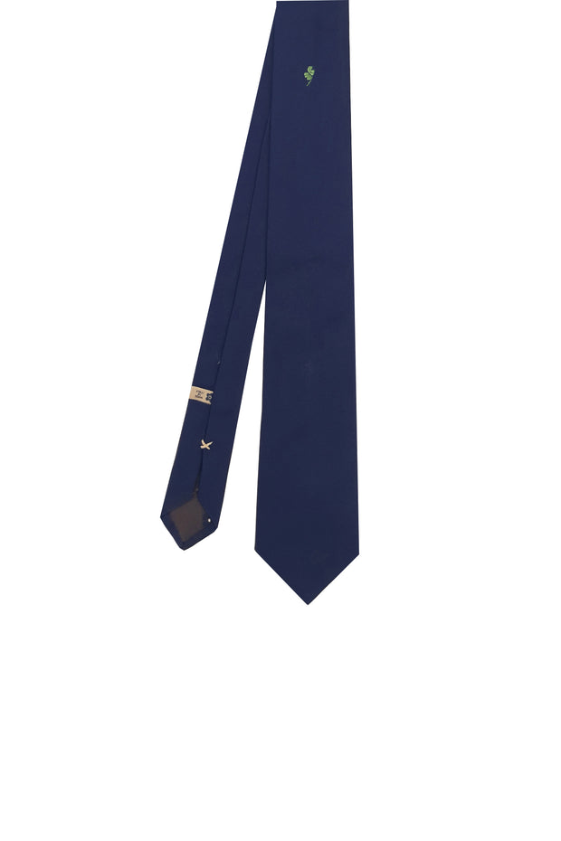 Blue silk tie with four-leaf clover under the knot