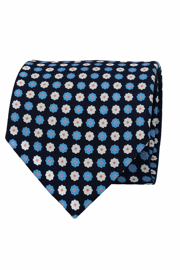 Cravatta in seta stampata blu con pattern floreale azzurro e bianco
