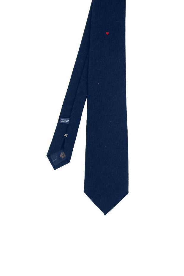Blue silk tie with little red heart under the knot
