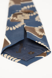 hand made tie with brown design on a blue background- cravatta fatta a mano con un design marrone su sfondo blu
