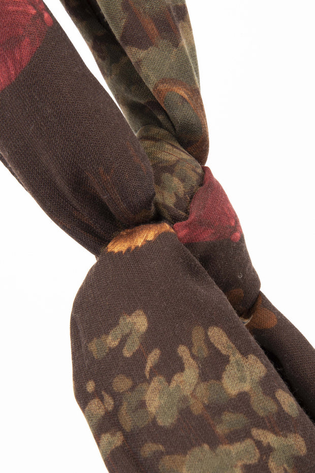 brown scarf with green leaves and golf theme
