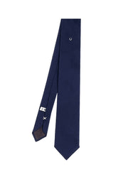 Blue silk tie with horseshoe under the knot