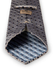 fumagalli label on the back of the tie with diamonds and flower