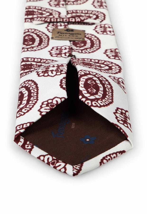 hand made printed tie with burgundy fantasy pattern and fumagalli label