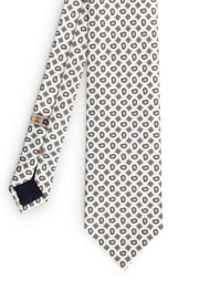 frontal view of the white paisley patterned silk printed tie