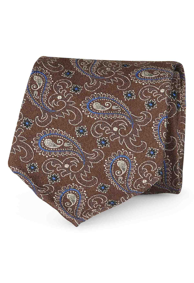 Cravatta jacquard sfoderata in seta marrone con piccoli poisley bianchi e blu - Fumagalli 1891