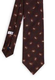 front vision of the tie with brown background with paislet white and burgundy details