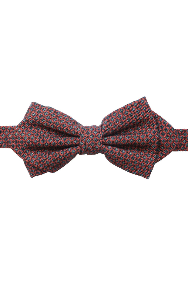 This bow tie has a pesticular shape, it's orange with little diamonds